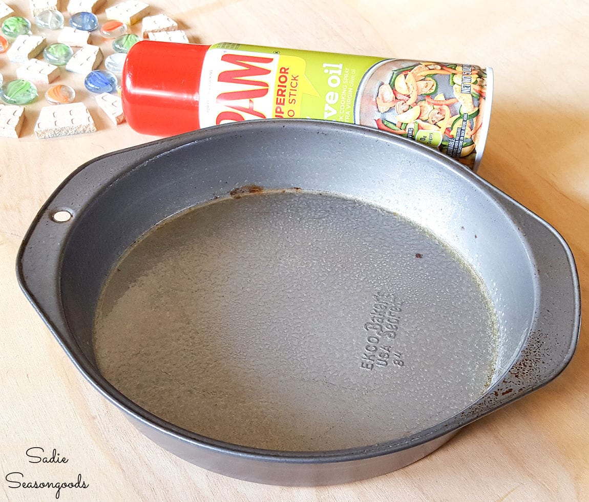 Lubricating a cake pan before adding concrete mix