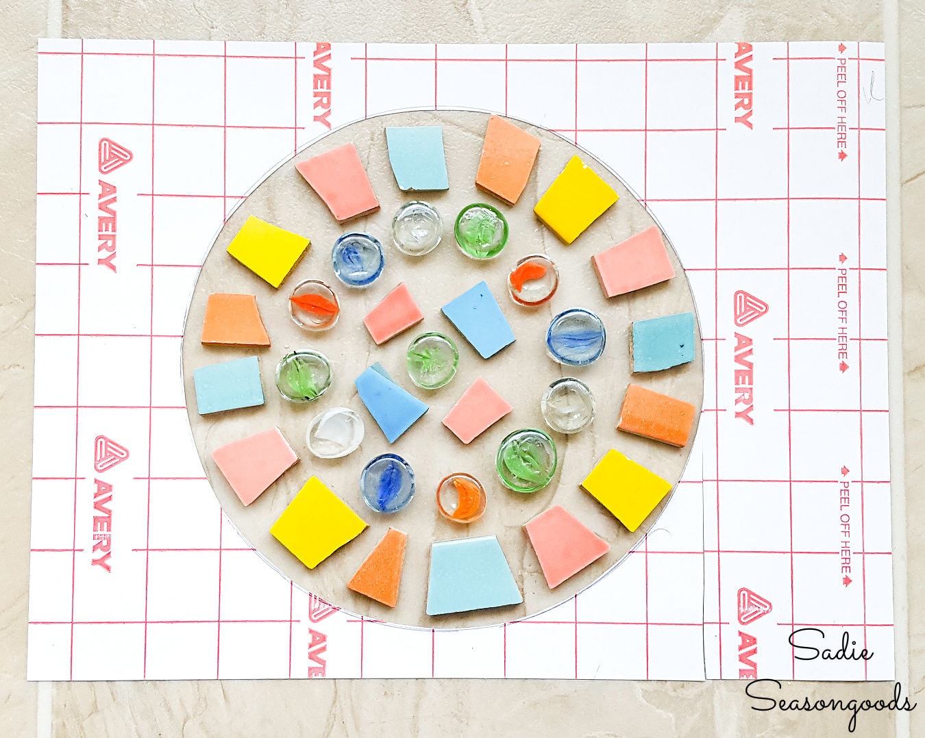 Making a mosaic stepping stone with glass gems