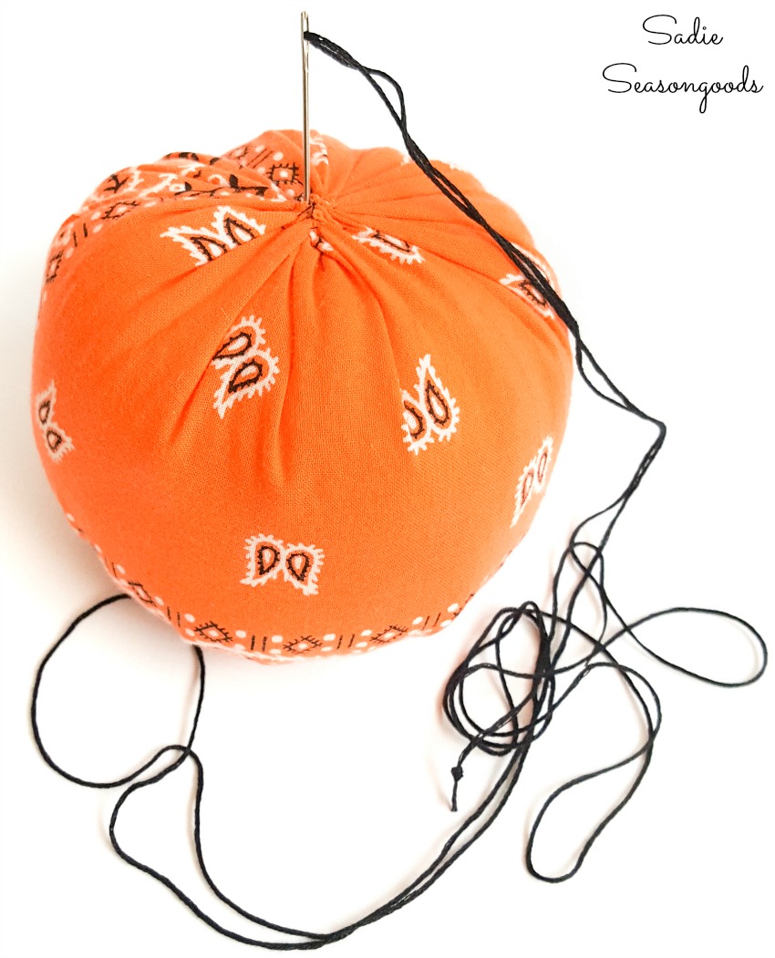 Embroidery floss in a contrasting color to add the ridges to a fabric pumpkin