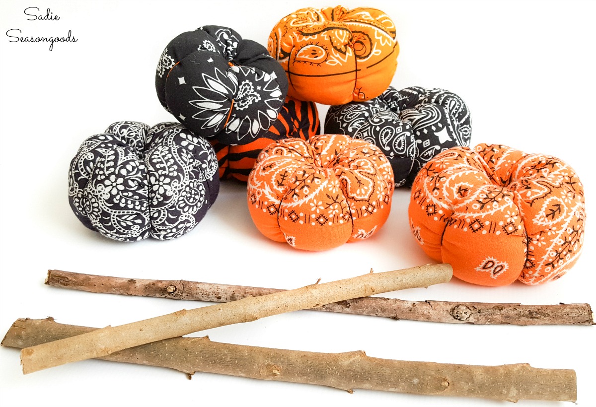 Pumpkin stems from branches on fabric pumpkins