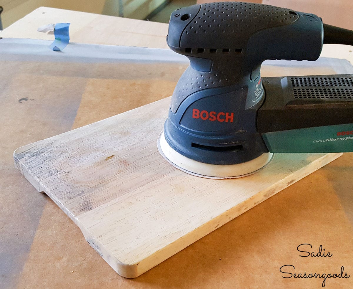 Sanding a cutting board from the thrift store