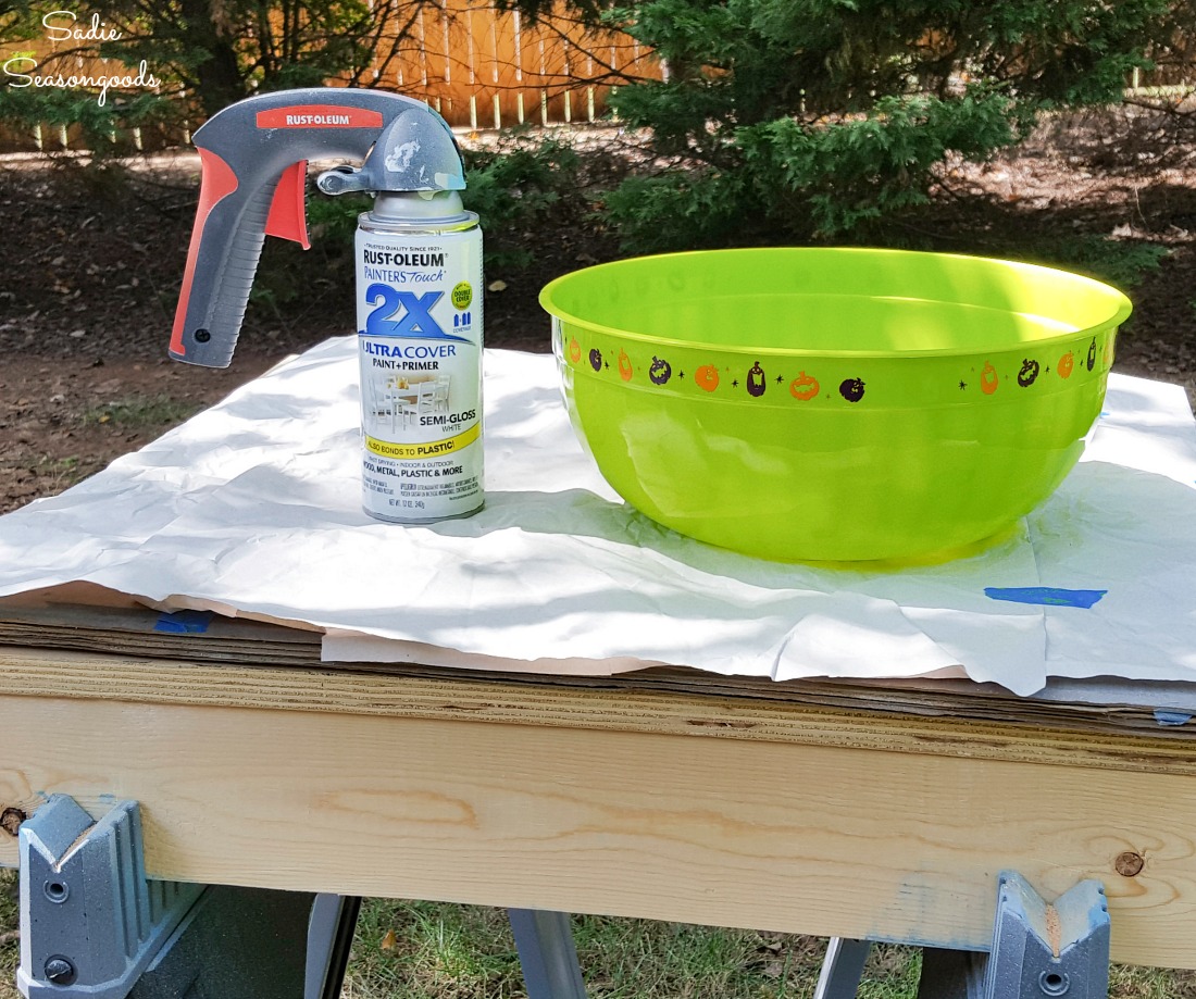 Spray painting a Halloween candy bowl