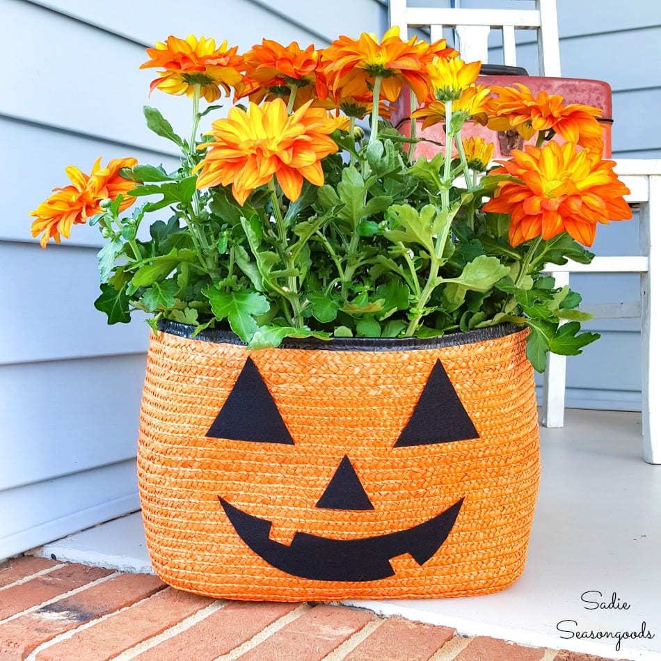 Halloween porch decorations from a straw tote as a jack o lantern