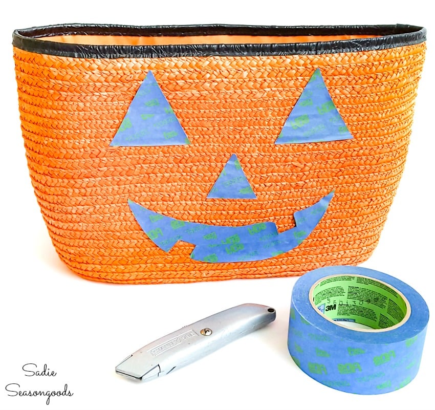 Making a jack o lantern face on a straw tote