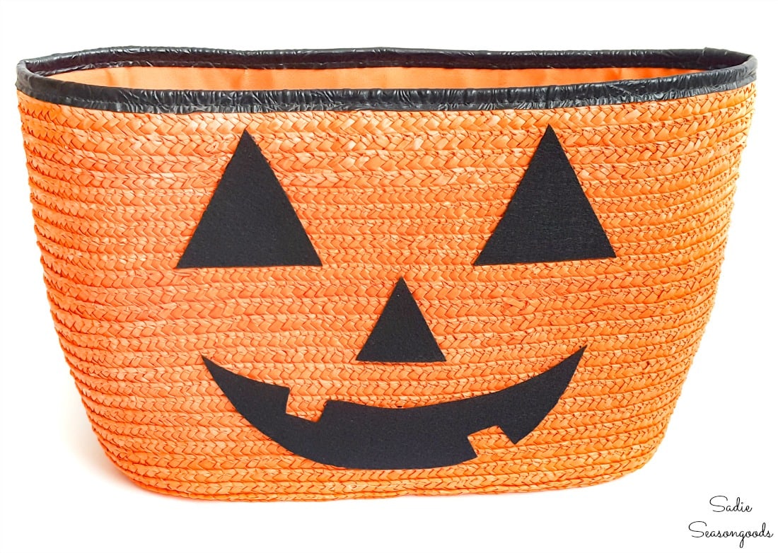 Straw tote as a jack o lantern planter