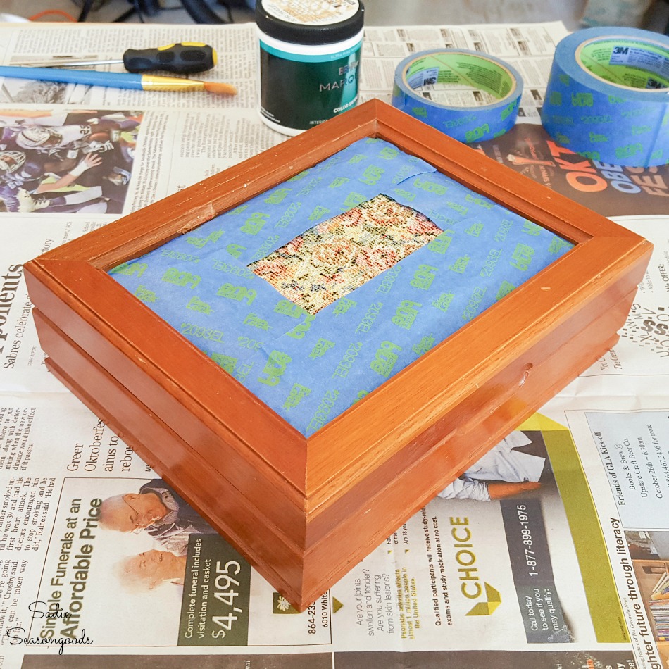 Protecting a tapestry cushion lid with painter's tape