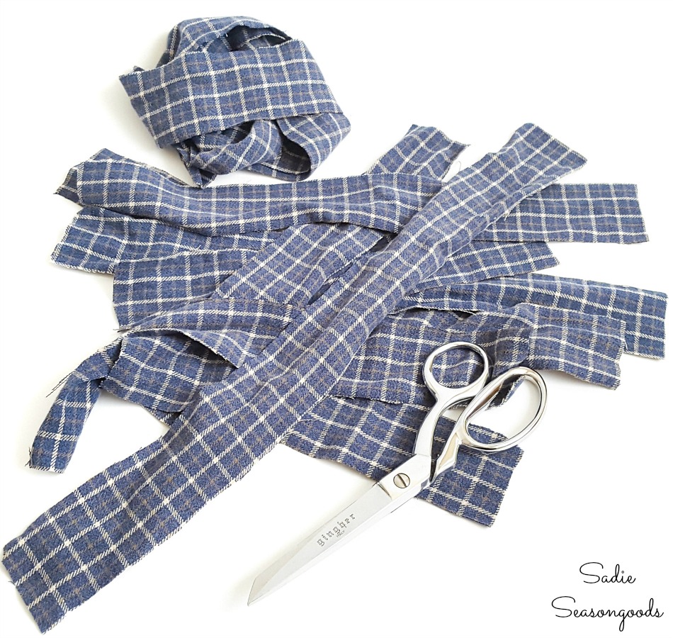 Cutting a flannel shirt into strips to make ribbon