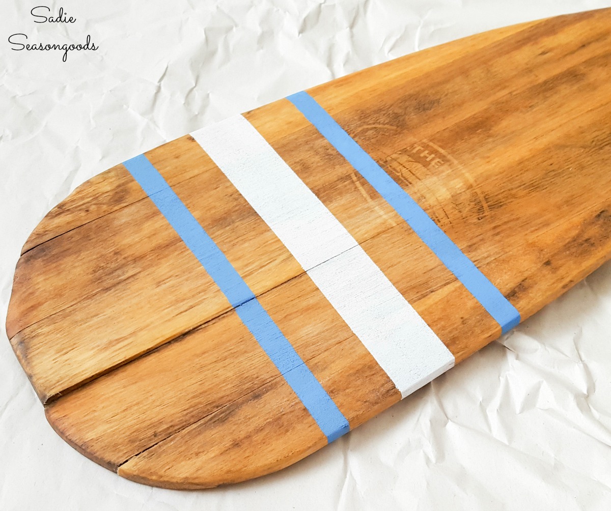 Nautical stripes on wooden oar decor