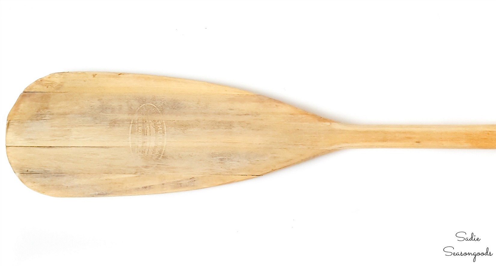 Sanding down a boat oar before using wood conditioner