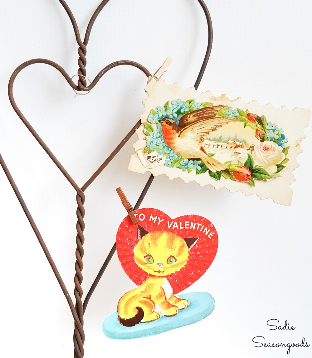 Vintage valentine decorations with little valentines that are clipped to a rug beater