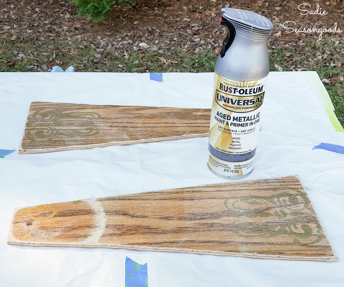 Galvanized spray paint on ceiling fan blades to create the small windmill decor