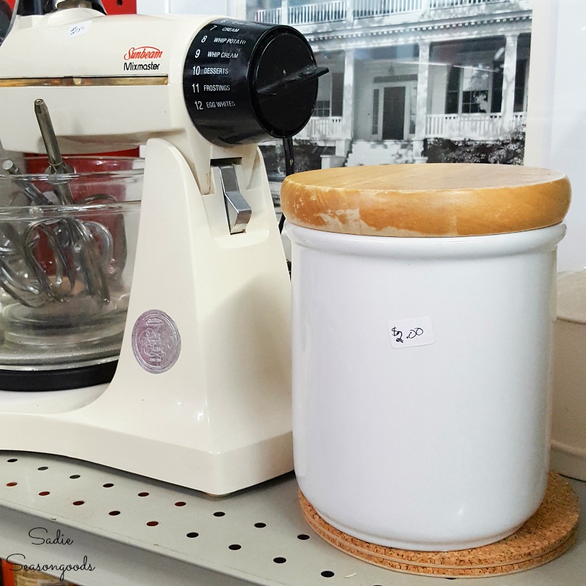 White ceramic canister at a thrift store