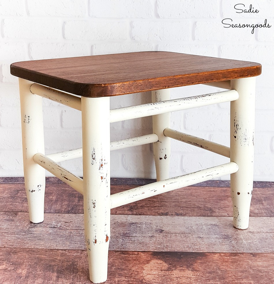 Farmhouse footstool that was restored with a wooden cutting board