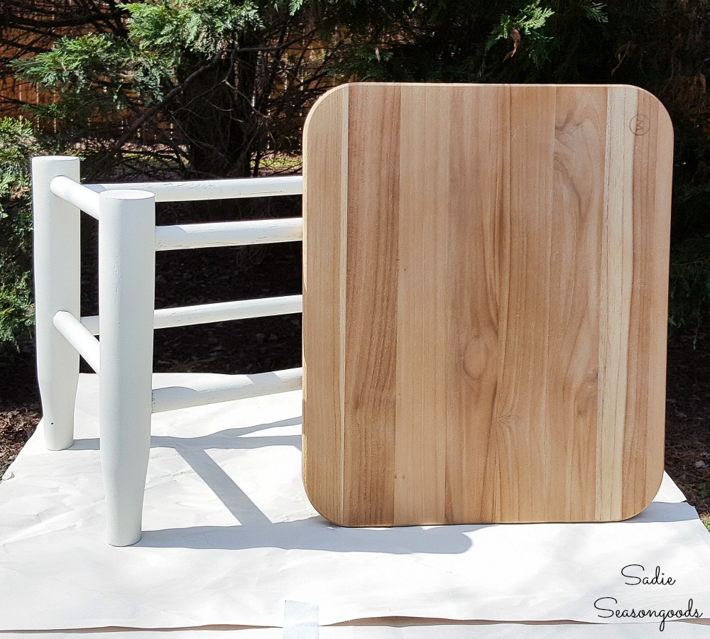 Replacing the rush seat of a vintage footstool with a wooden cutting board