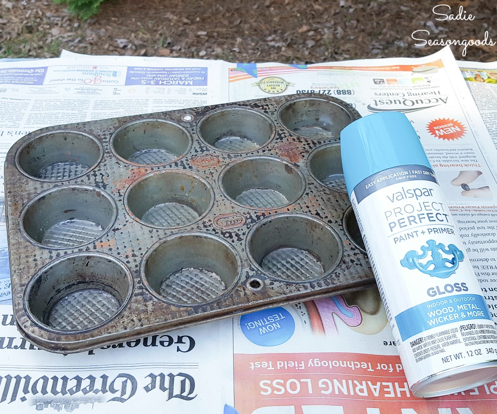 Spray painting a muffin tin that will be used as plant starting pots