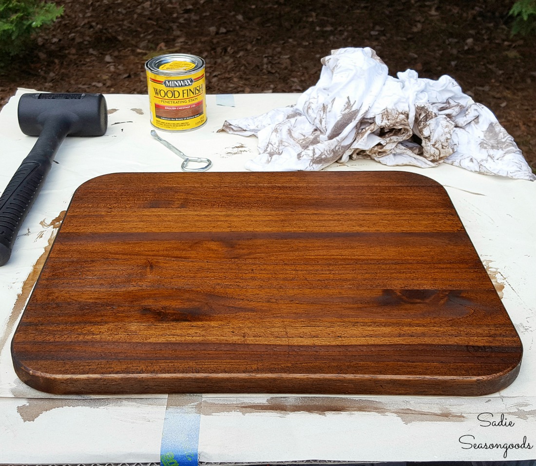 Wood Stain in English chestnut on a wooden cutting board to go on a low footstool