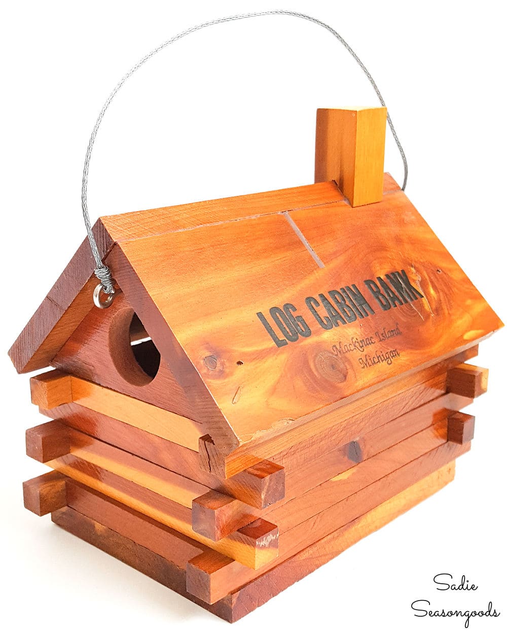 Cabin birdhouse from a vintage coin bank