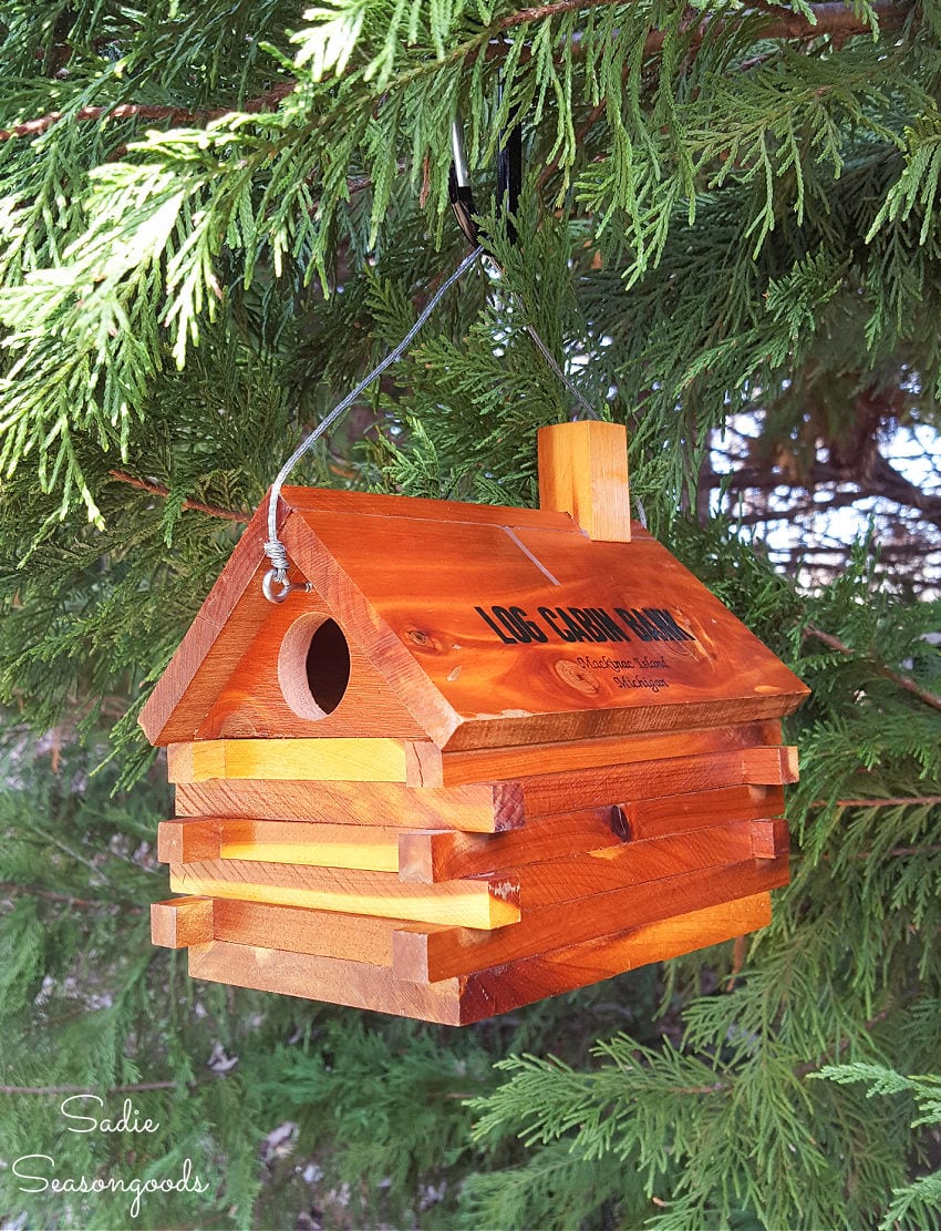 Upcycling a vintage coin bank into a log birdhouse