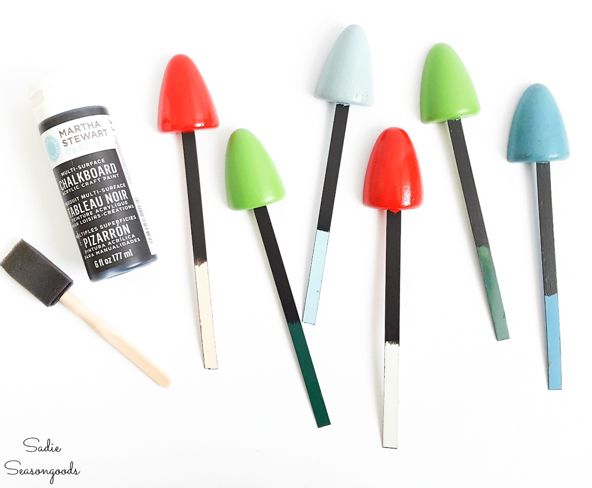 Chalkboard paint on wooden shoe stretchers as plant markers