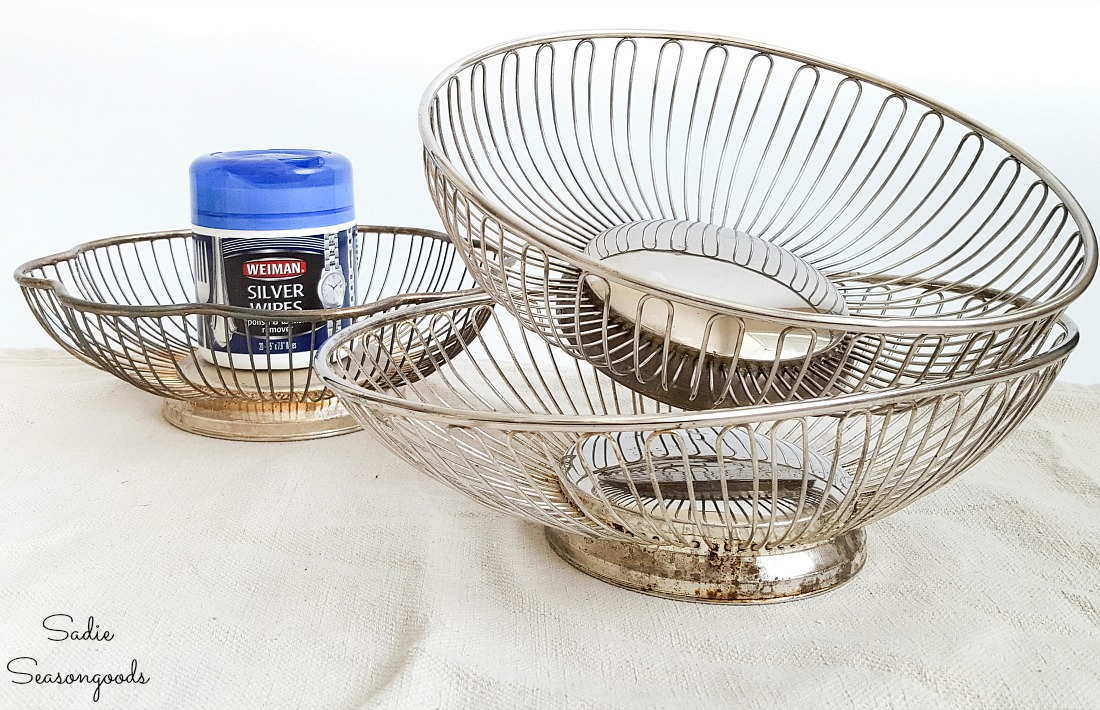 Silver wipes on wire bread baskets before upcycling with galvanized spray paint