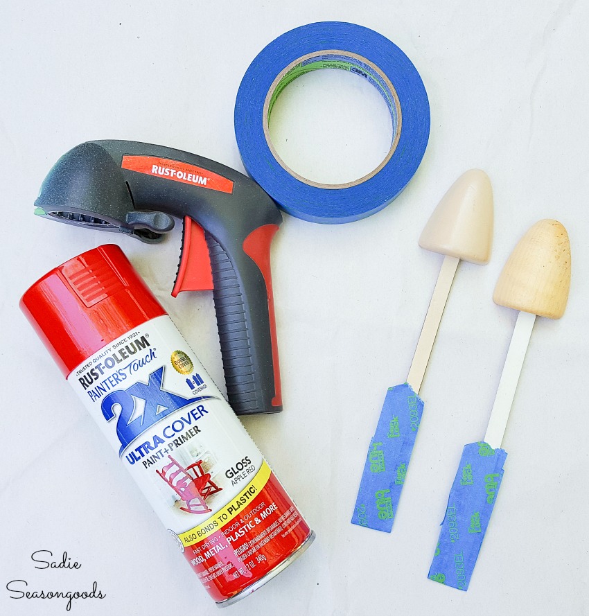 Spray painting a wooden shoe tree for upcycling as mushroom garden decor