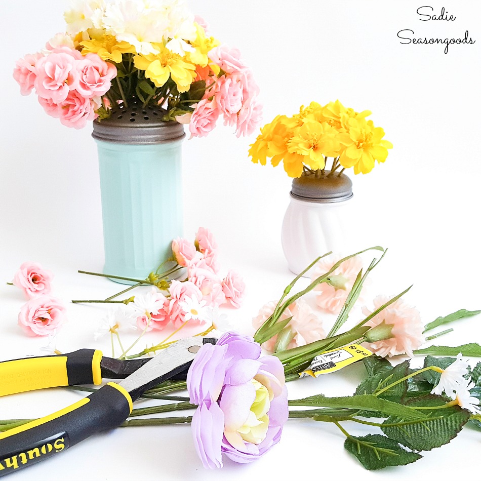 Arranging flowers with a floral frog on a cheese shaker