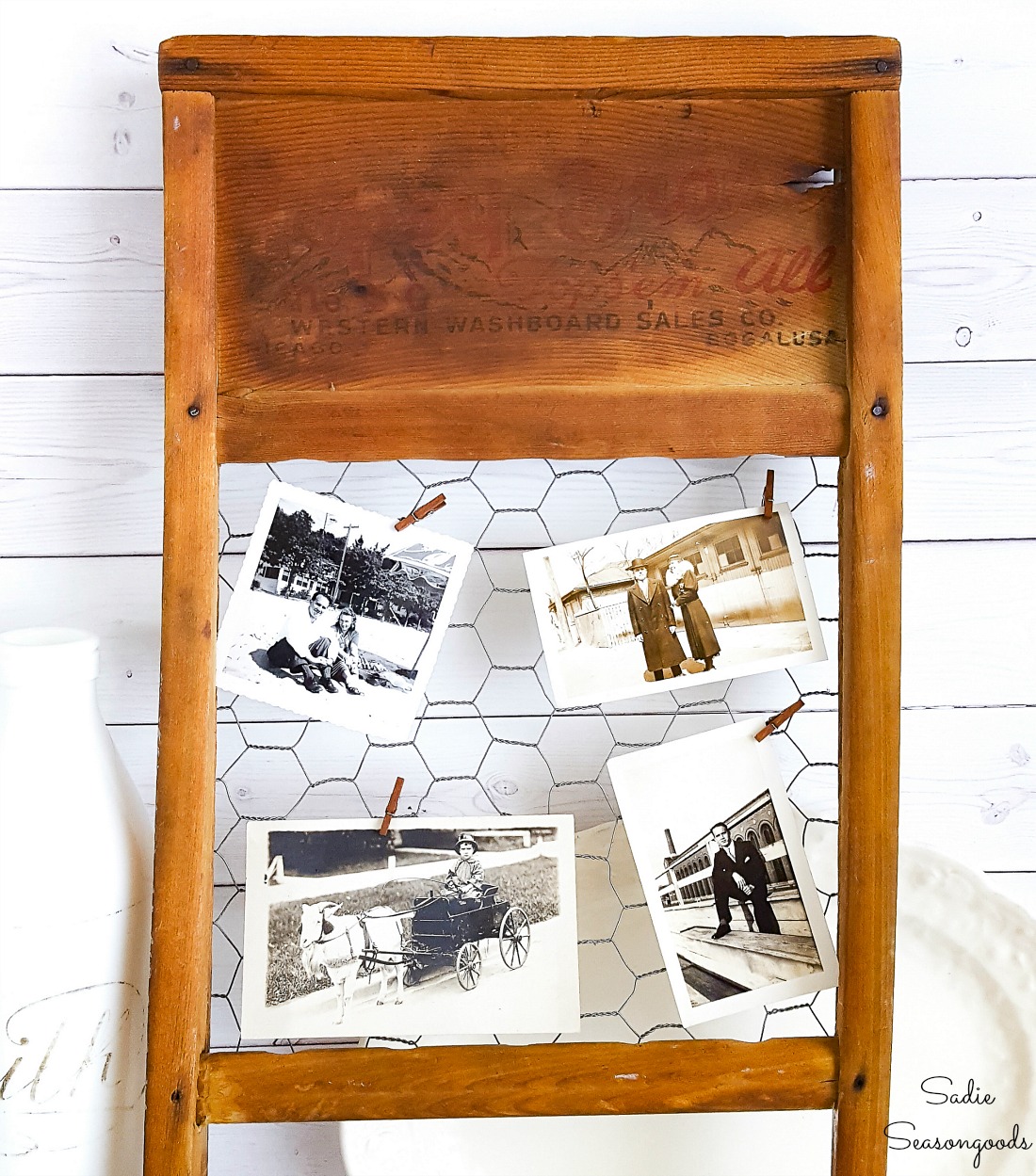 Primitive farmhouse decor with an antique washboard as a chicken wire frame