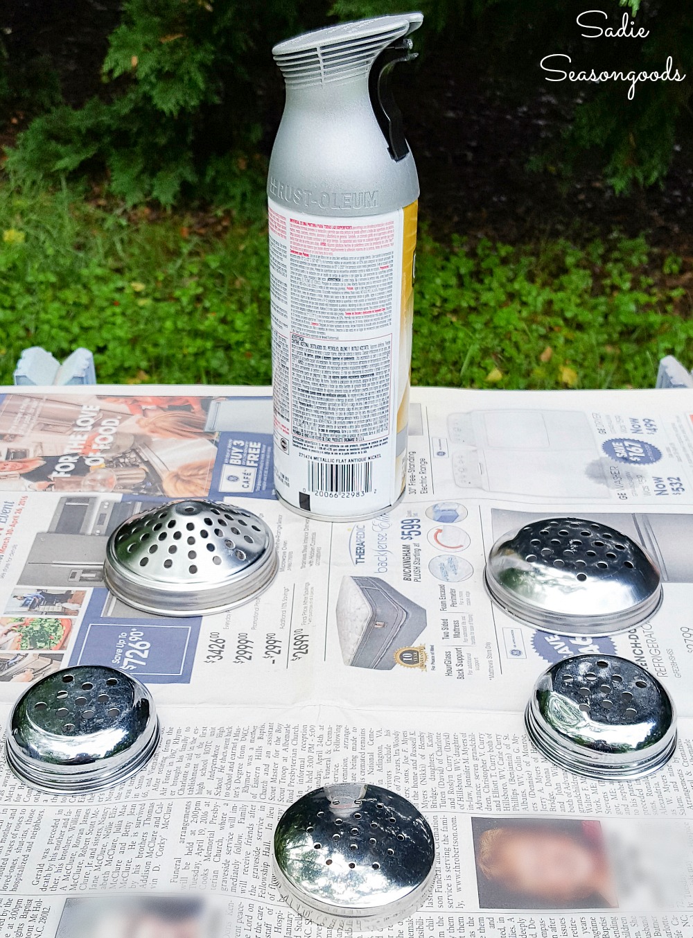 Spray painting a shaker top to be used as a flower frog