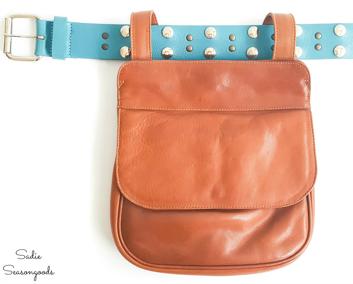 Adjusting the strap of a small leather handbag