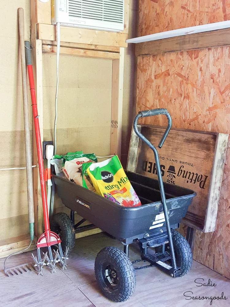 Folding workbench and potting bench in a storage shed