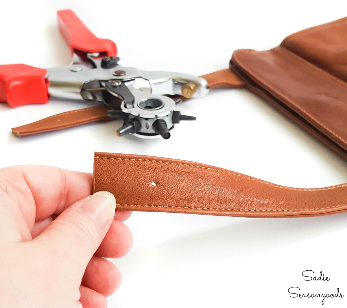 Punching holes in a leather strap for rapid rivets