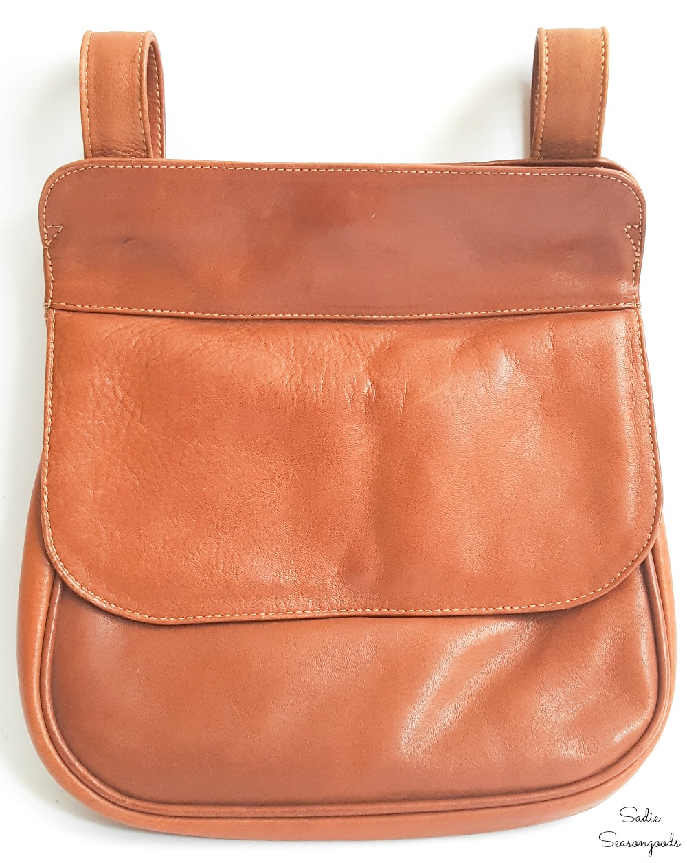 Repurposing a small handbag as a hip purse