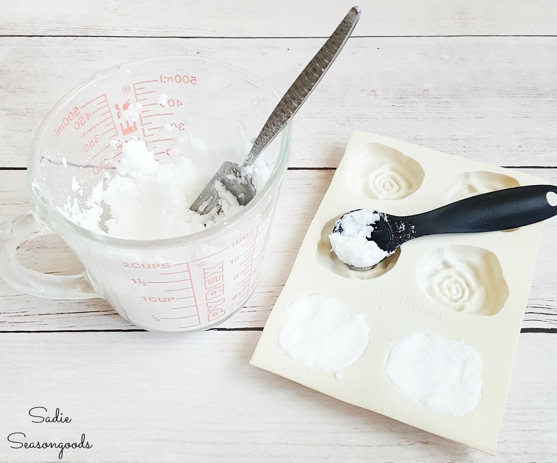 Pressing the shower melt recipe into butter molds