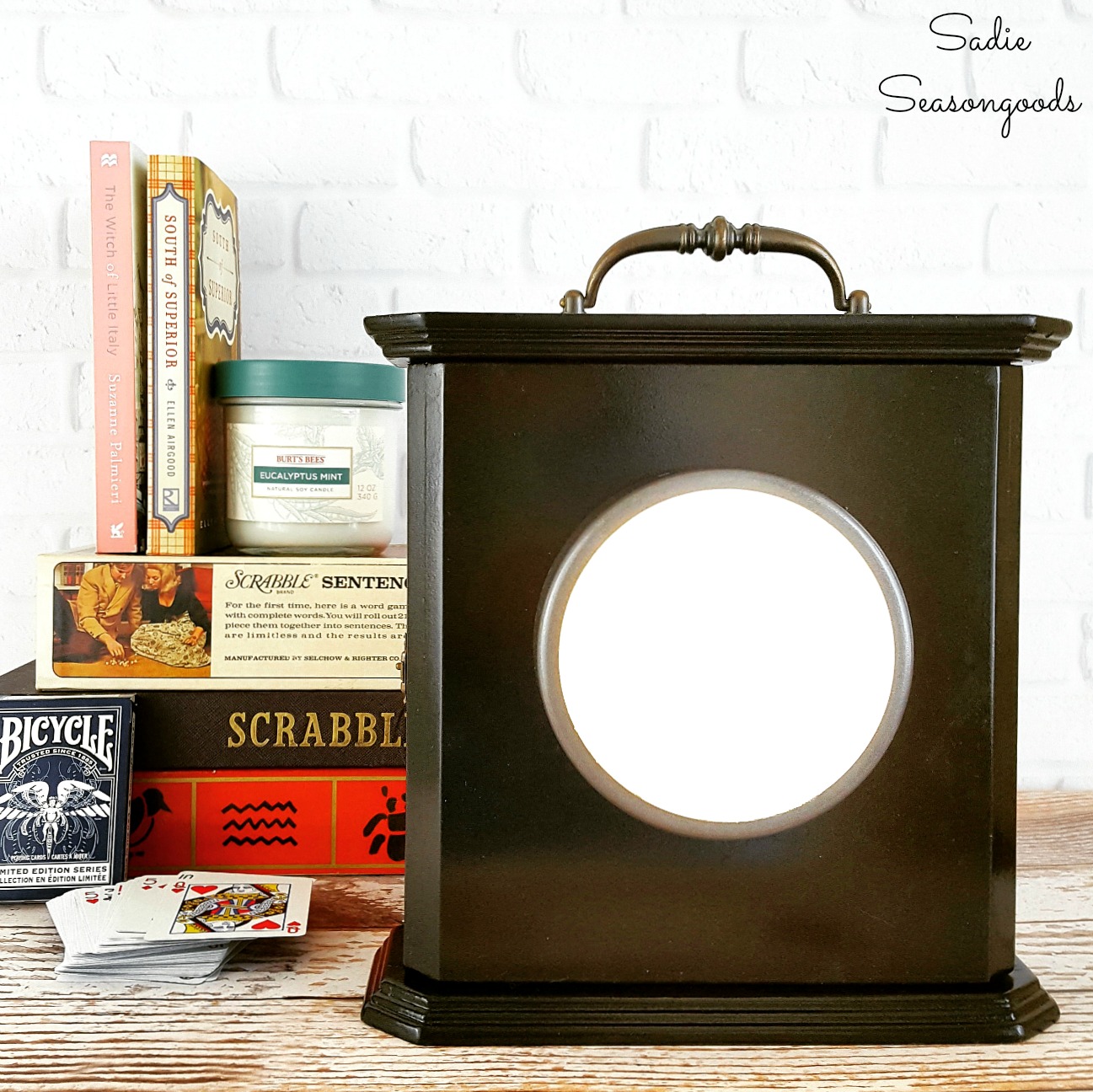 Clock Box that was upcycled into a power outage kit and emergency lamp that is filled with supplies and looks like a vintage lantern