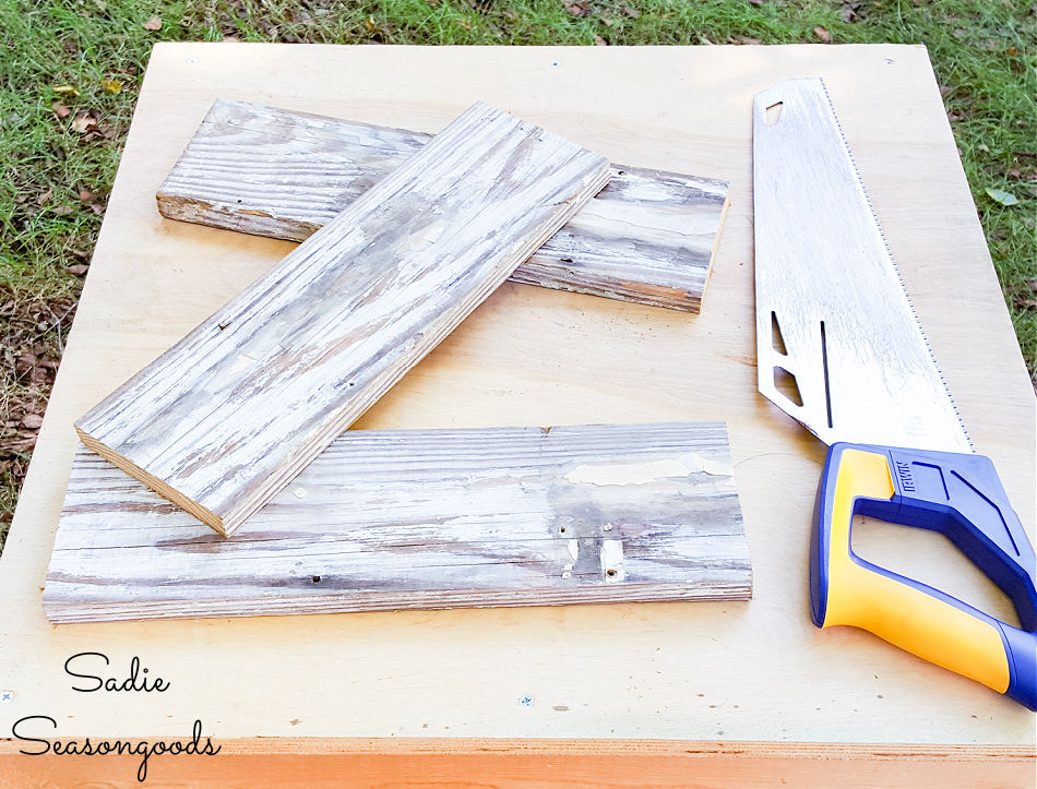 sawing the reclaimed wood planks