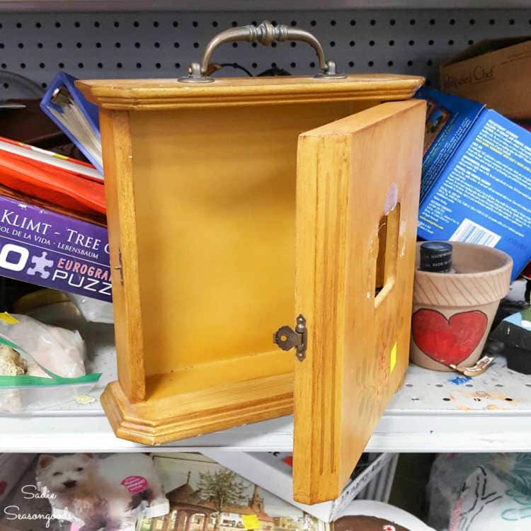 opening a small cabinet at goodwill
