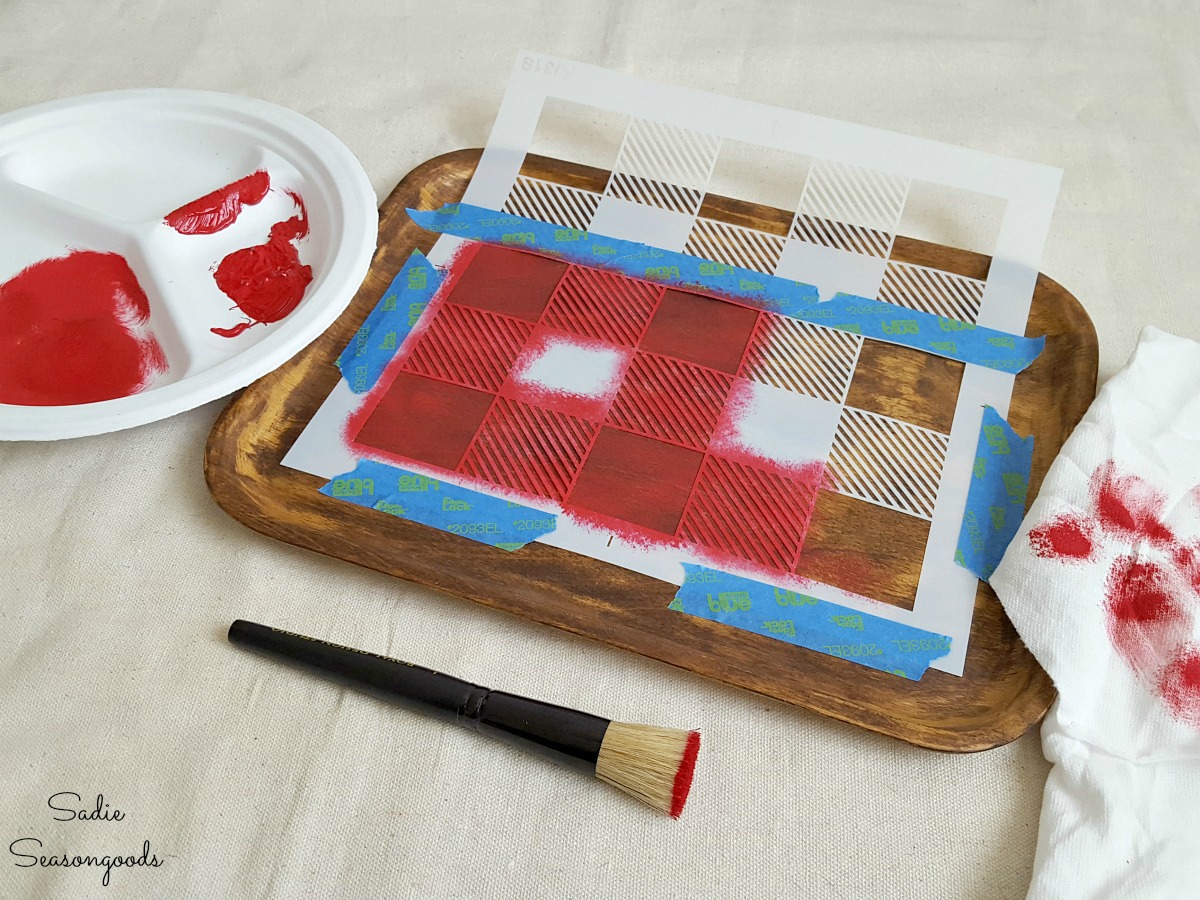 Red craft paint to create Buffalo check decor using a vinyl stencil from Funky Junk Interiors for rustic cabin decor