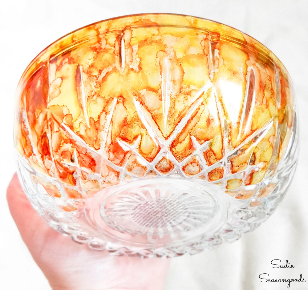 Alcohol paint in fall colors on clear glass pumpkins