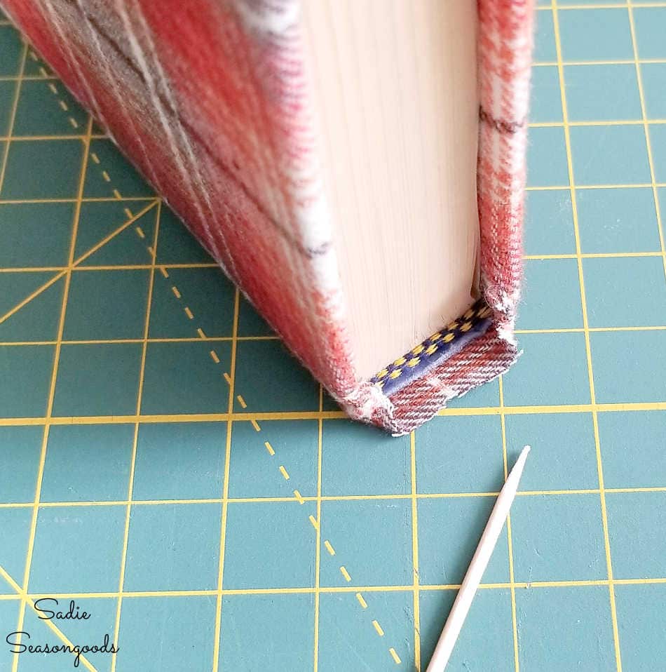 covering the spine of books with fabric