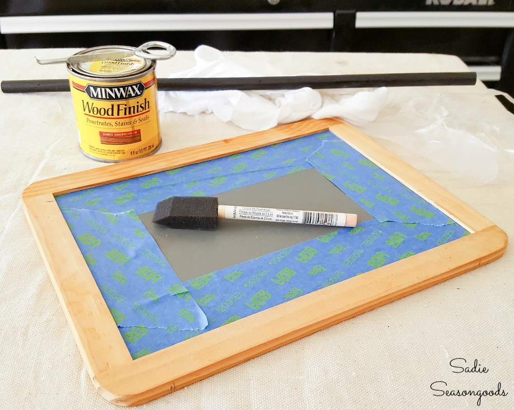 Staining a small chalkboard for a Happy Halloween sign