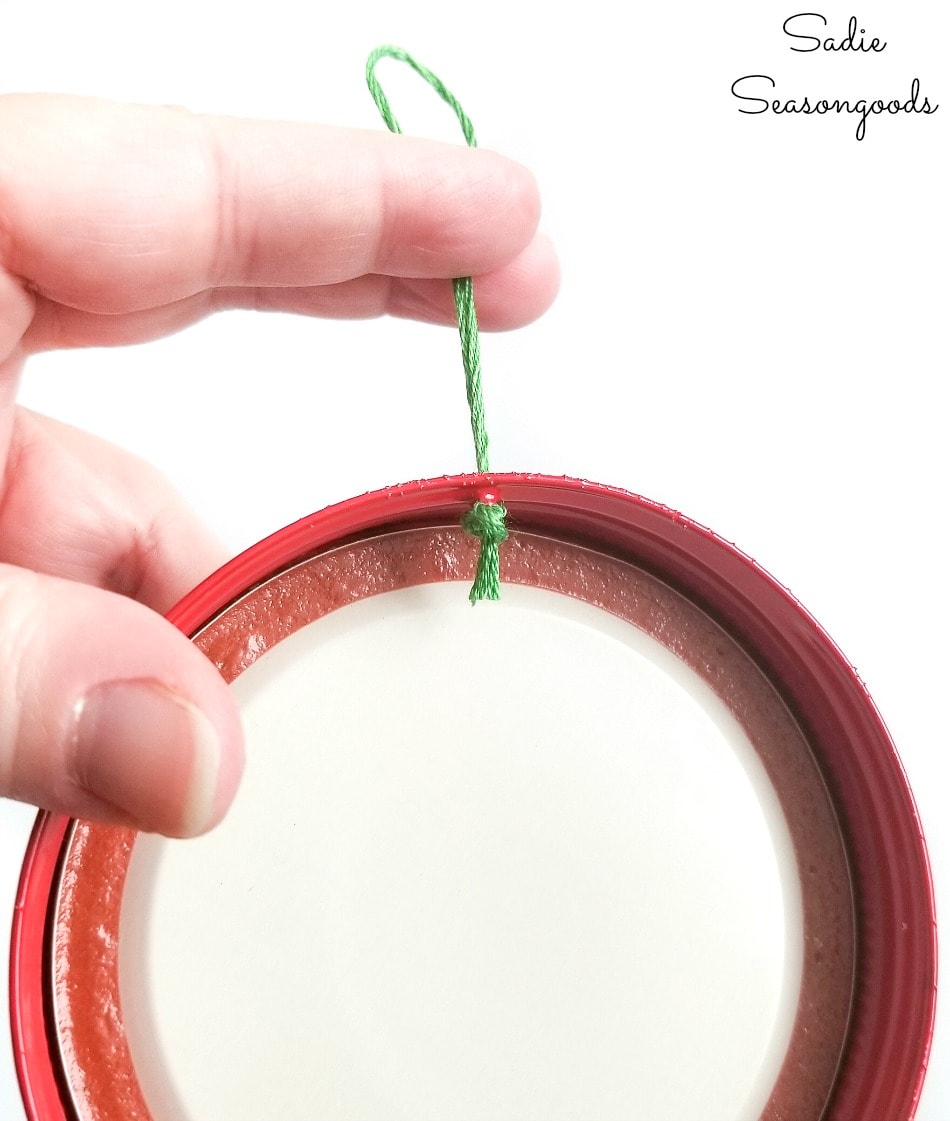 Adding a hanger to mason jar lid ornaments