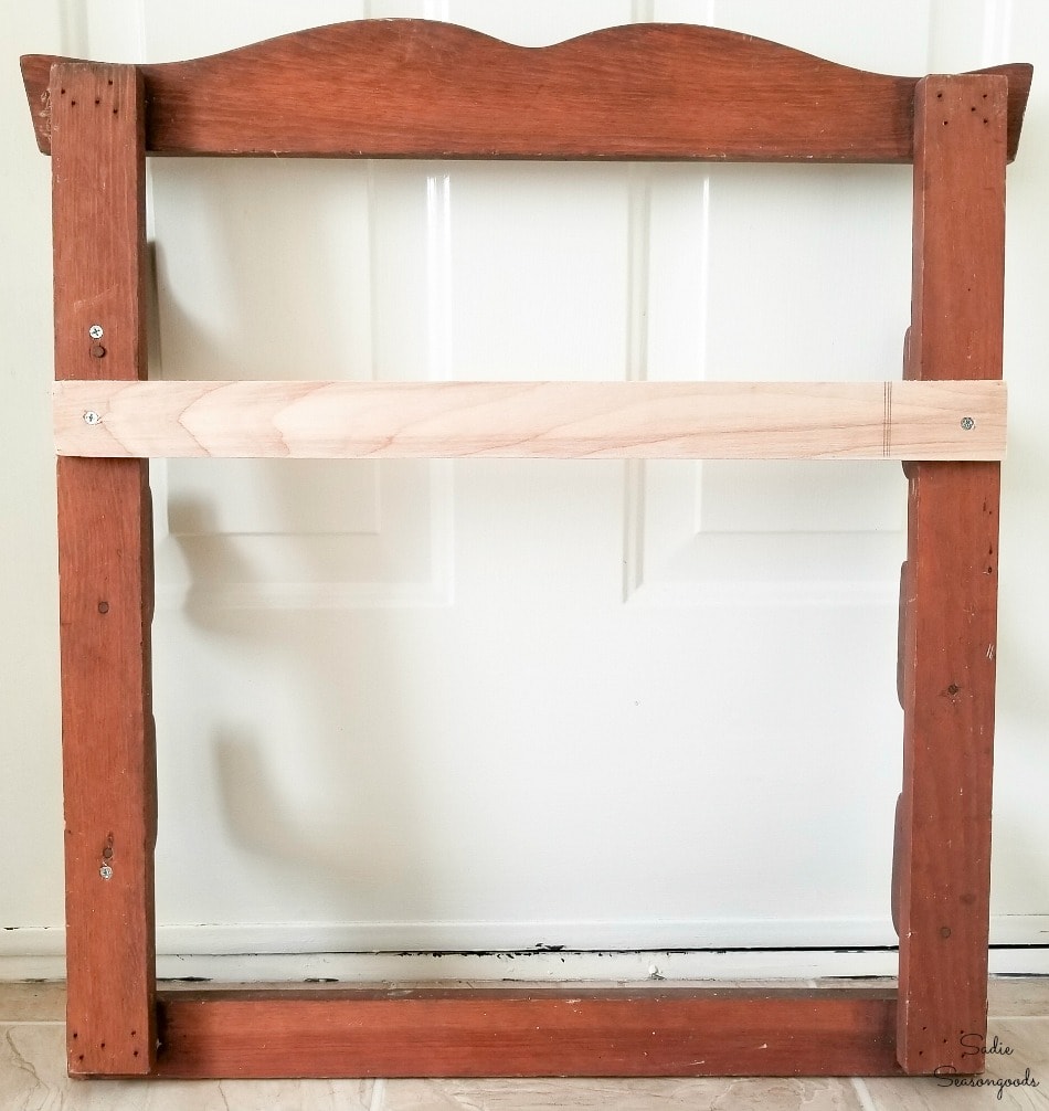 Attaching a piece of plywood to a hanging gun rack Attaching a piece of plywood to a hanging gun rack