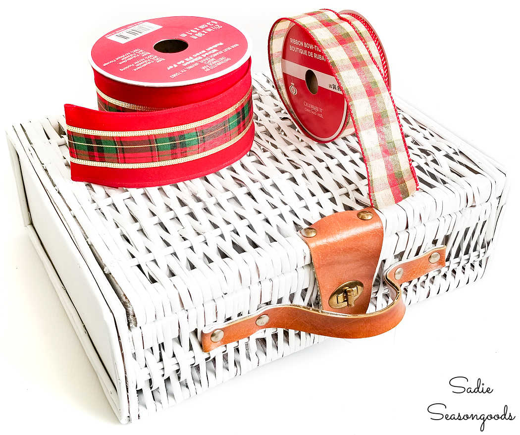 decorating a small picnic basket with ribbon