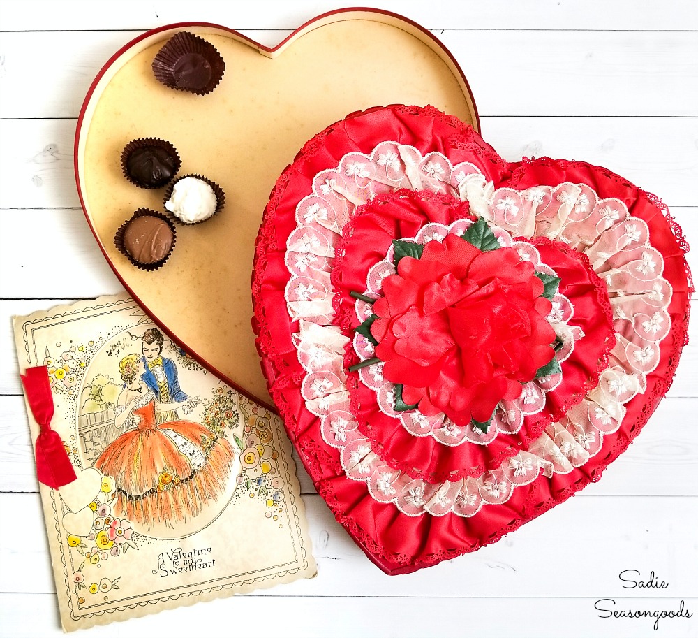 Vintage valentine decorations with a heart shaped candy box