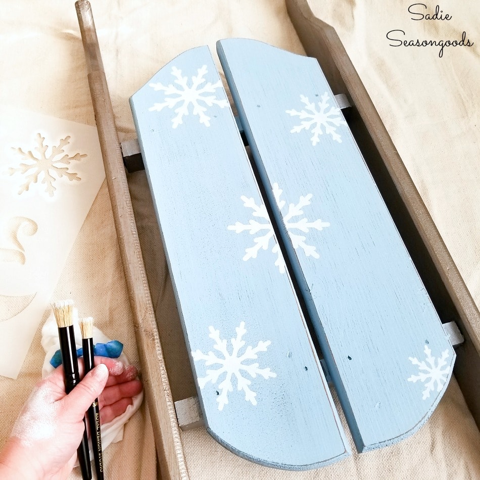 Stenciling a decorative wooden sled