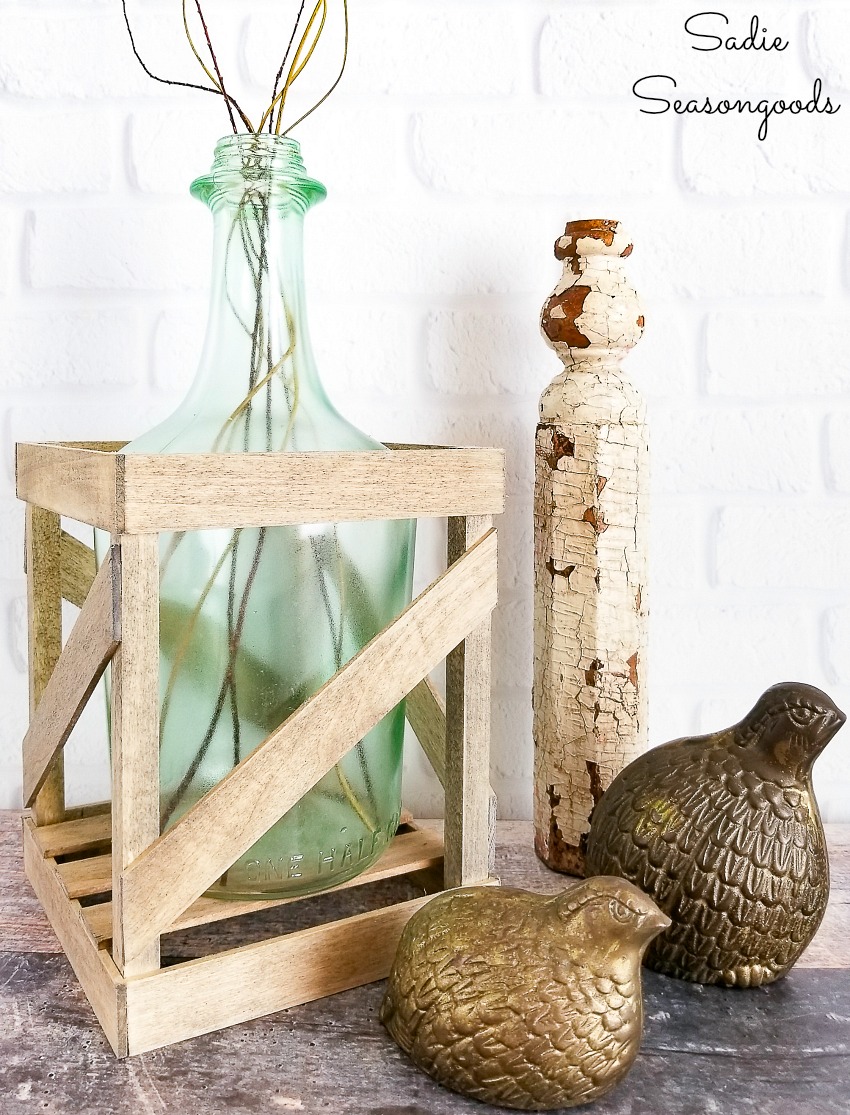 Empty wine bottles for glass bottle crafts by making a demijohn vase