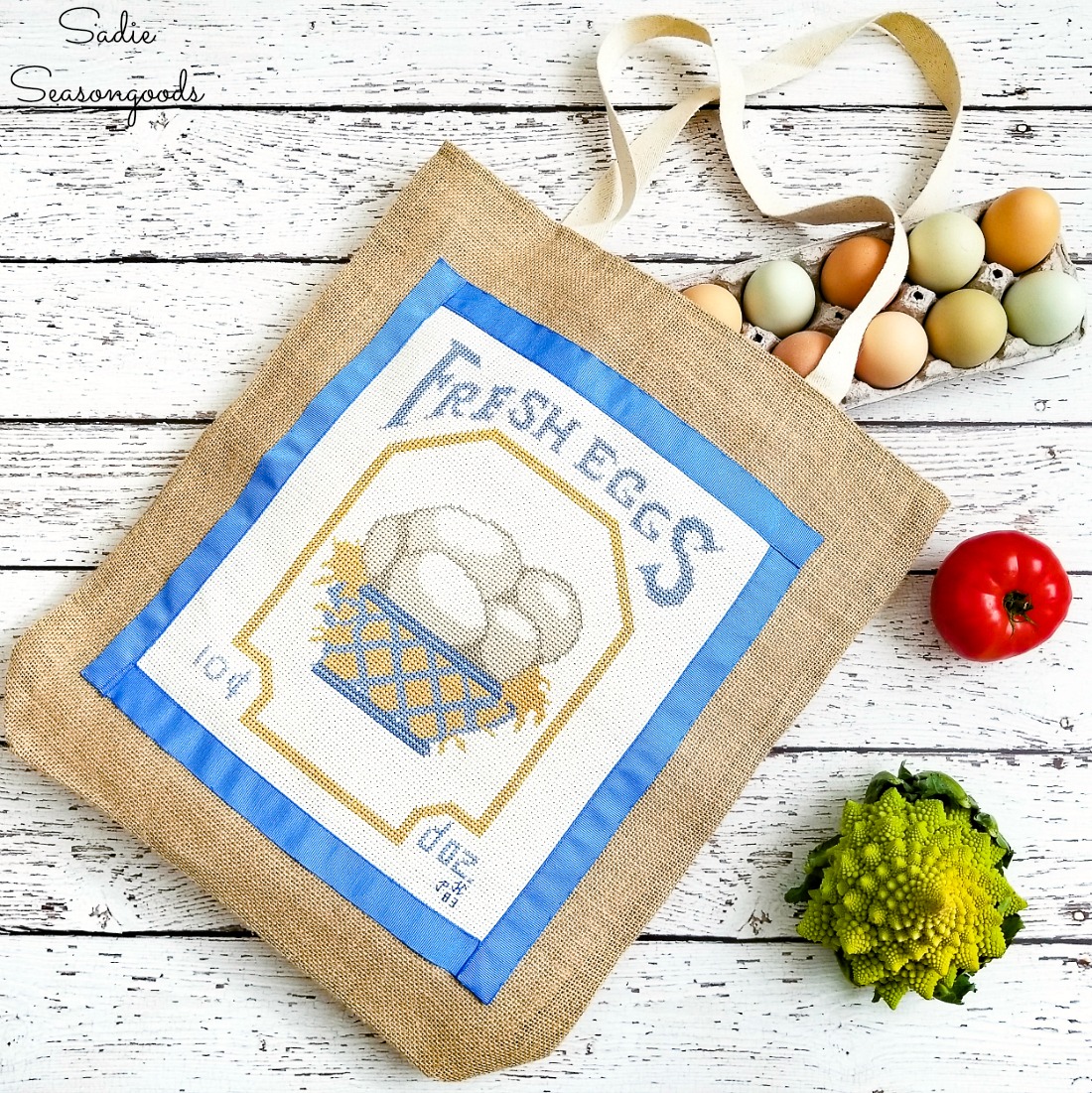 Repurposing a counted cross stitch on a jute tote bag to make a reusable grocery bag