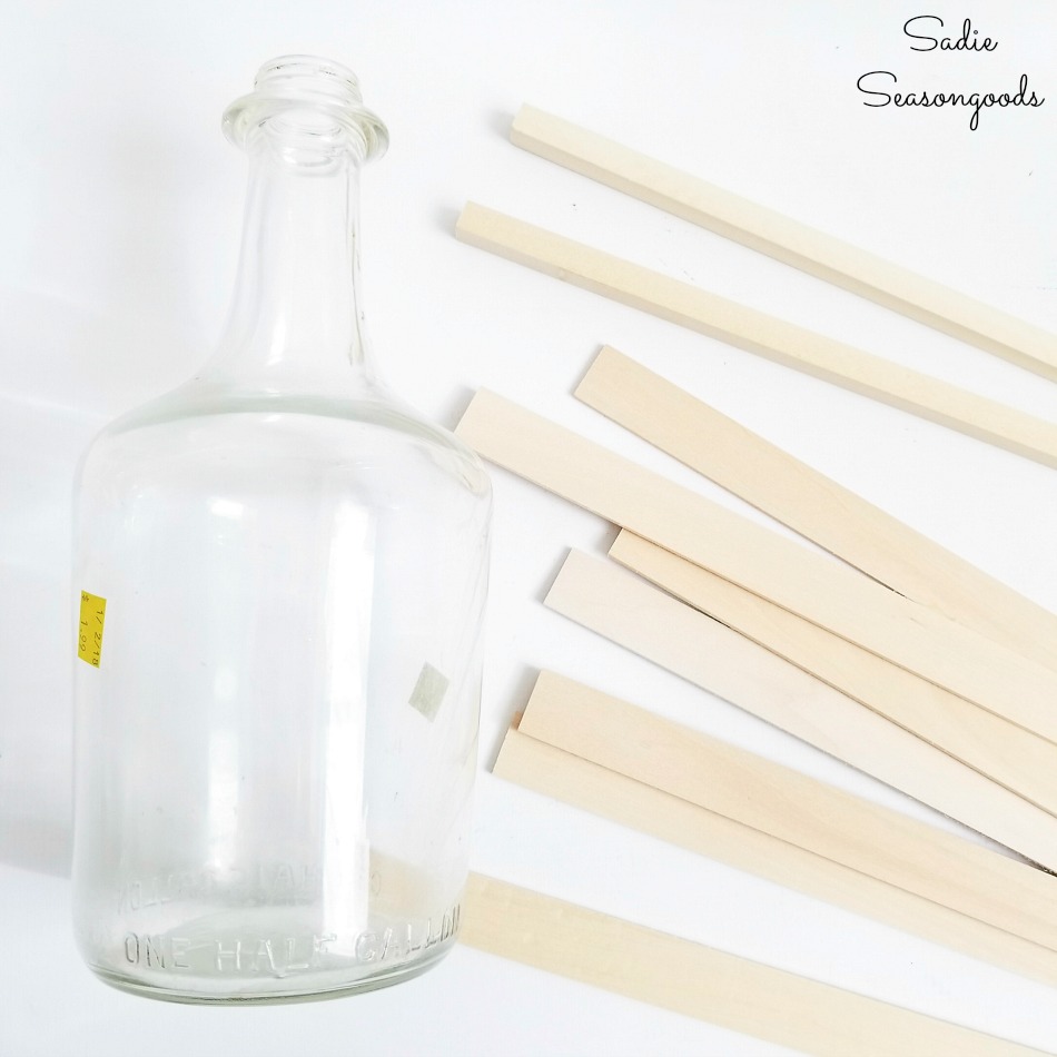 Upcycling the empty wine bottles into a glass demijohn with craft wood