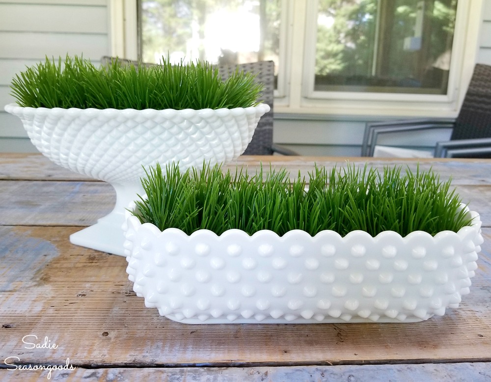 Cutting a plastic grass mat to fit inside the milk glass dishes as Easter decor ideas