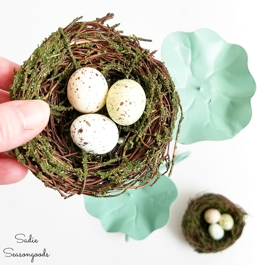 nest decor on a metal candle holder